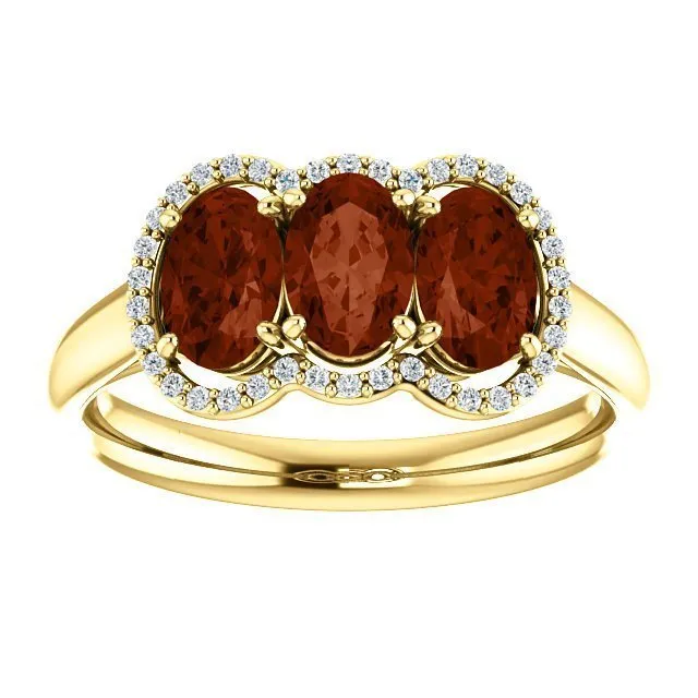 14KT GOLD 1.74 CTW GARNET & .10 CTW DIAMOND 3 STONE OVAL HALO RING