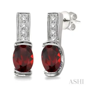 7x5  MM Oval Cut Garnet and 1/50 Ctw Single Cut Diamond Earrings in Sterling Silver