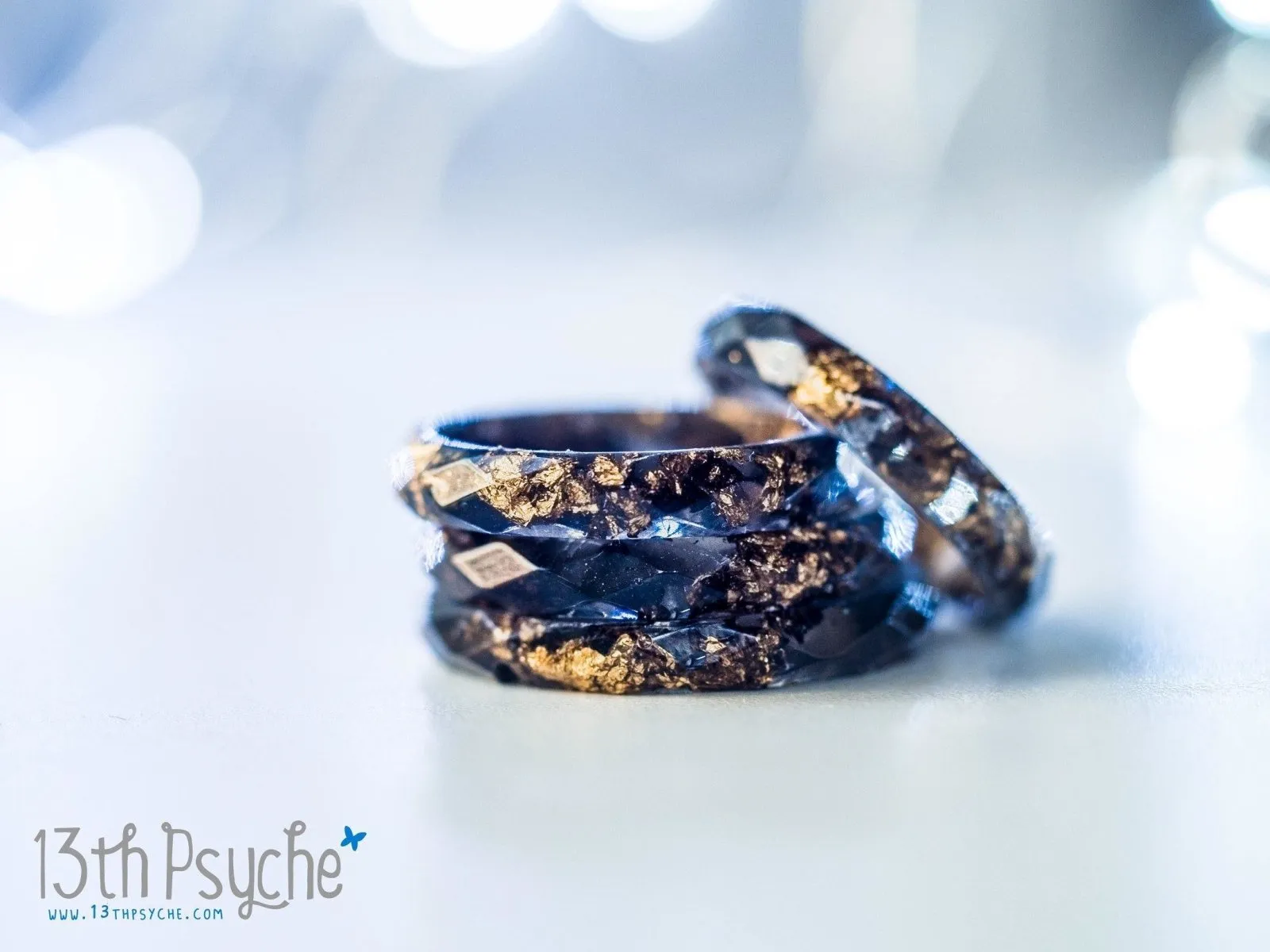 Black faceted resin ring with gold flakes