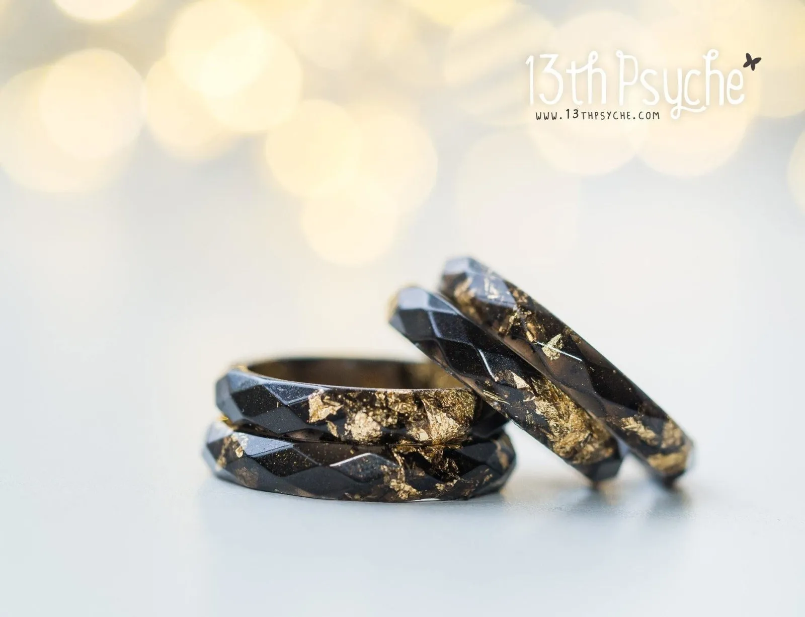 Black faceted resin ring with gold flakes