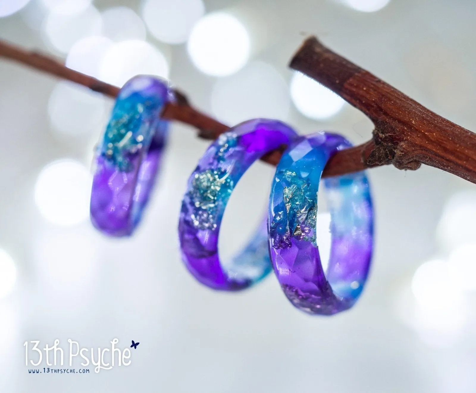 Purple and blue faceted resin ring with silver flakes