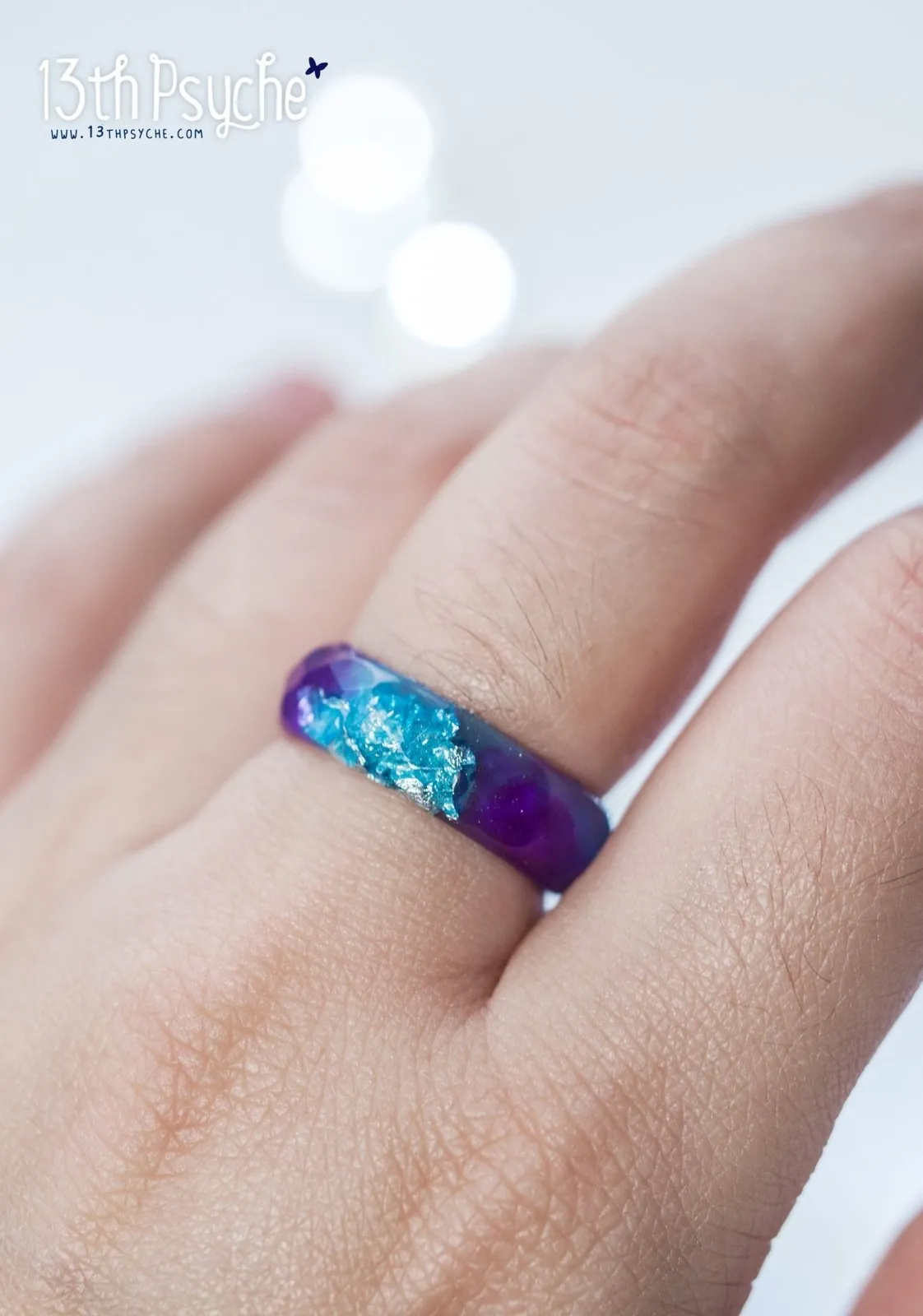 Purple and blue faceted resin ring with silver flakes