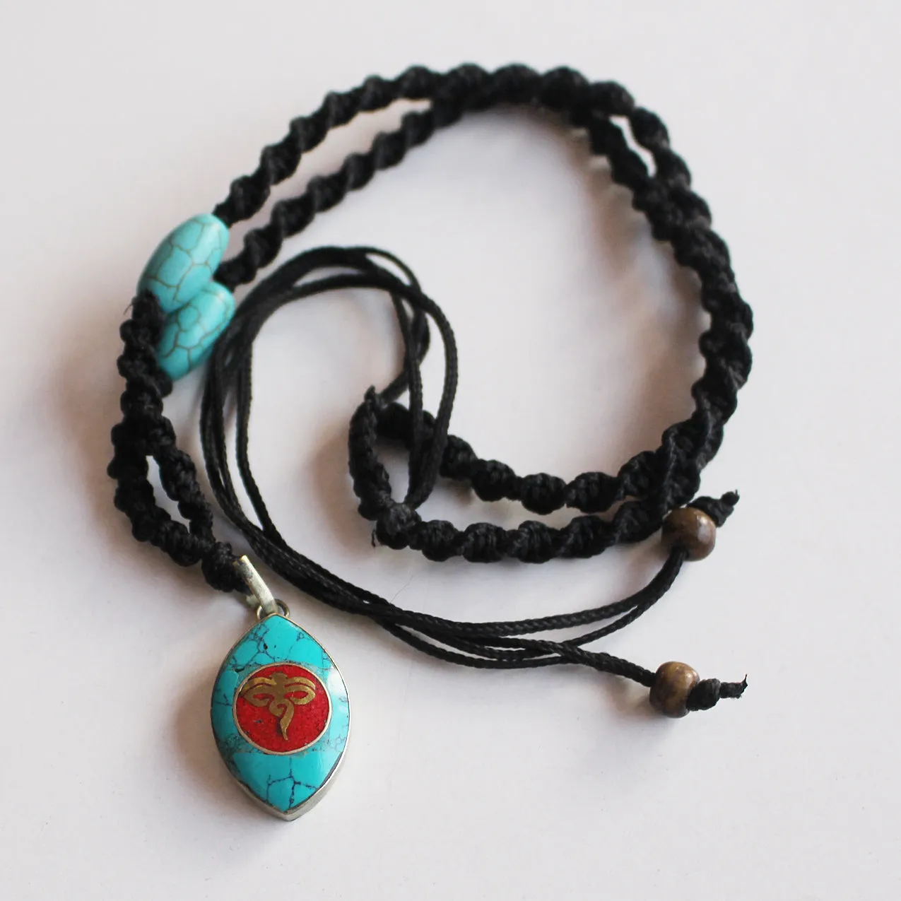 Turquoise and Coral Inlaid Buddha Eye Pendant Necklace